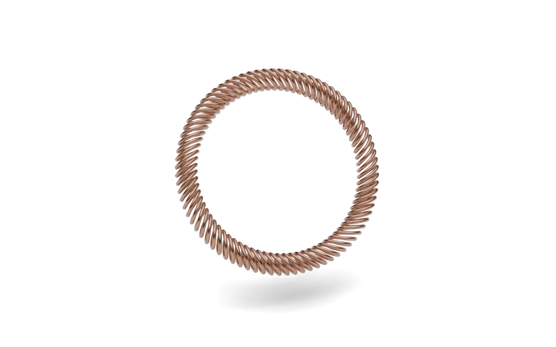Copper alloy canted coil spring formed into a closed ring